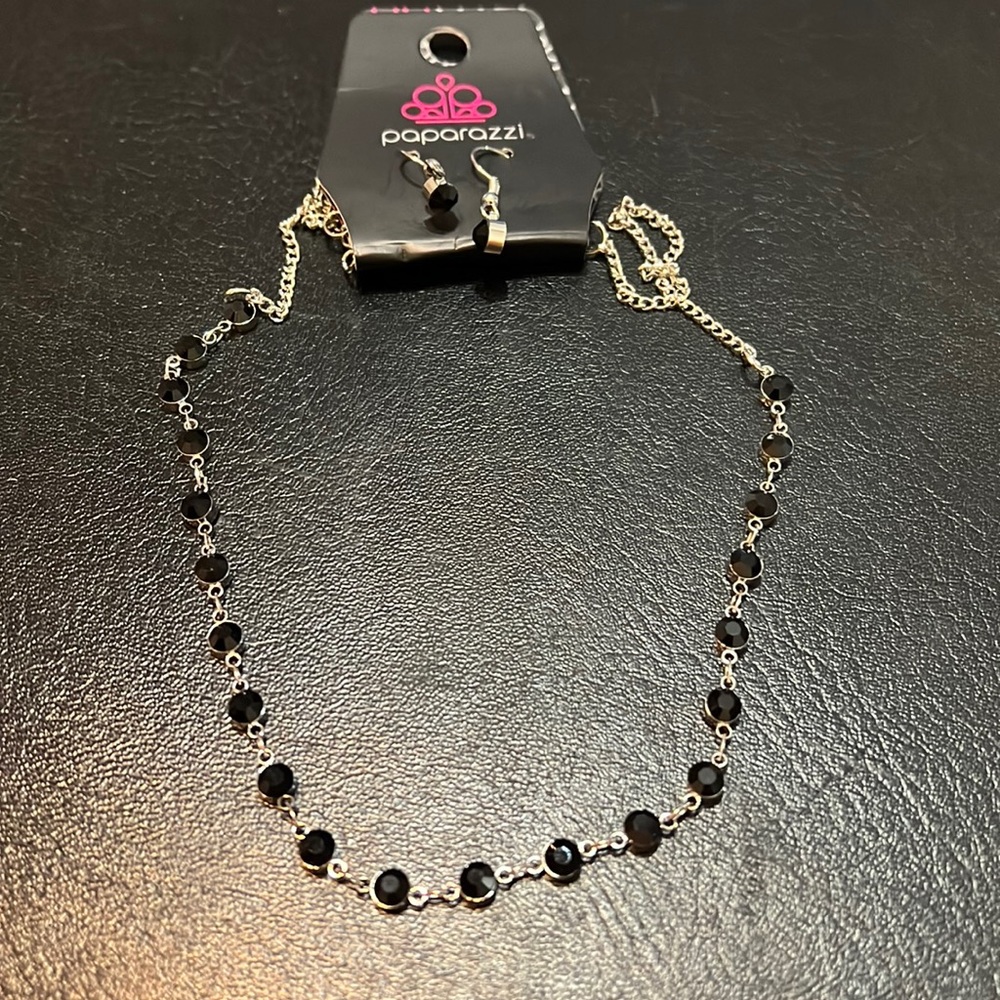Short silver necklace with black gem stones